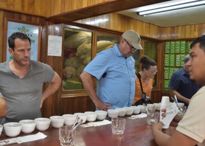 people getting ready to sample coffee beans