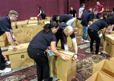 Team members putting Java City boxes together