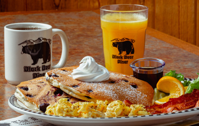 bears choice breakfast Coffee and Juice with a plate of Pancakes, Eggs and Fruit
